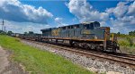 CSX 784 scoots through town with I018 in tow.